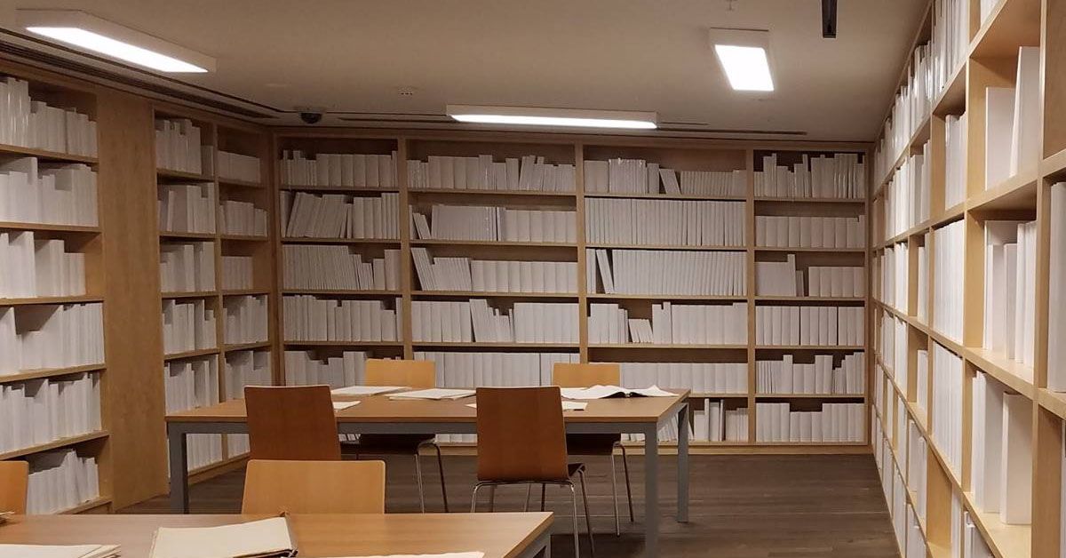 A photo of an art exhibit from Hobart's MONA: it is a room that looks like a library, but the books are all blank.